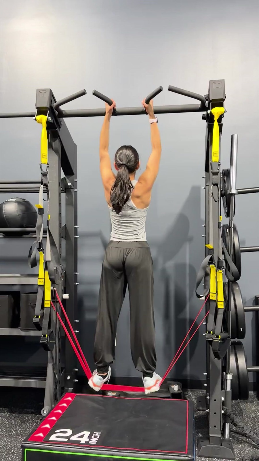 Member doing assisted pull-ups